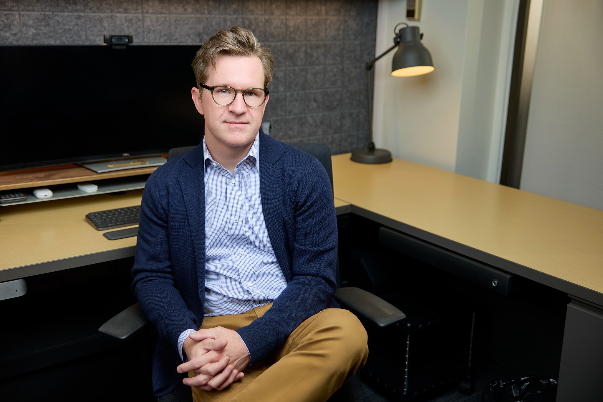 Dr. Cameron M. Clark seated in his Calgary office
